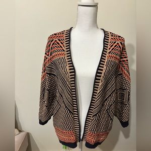 Cute waist-length cardigan open front.